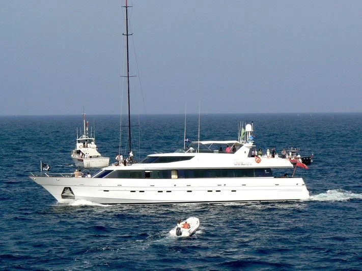 a boat with a person in it aboard PROVIDENCE Yacht for Sale
