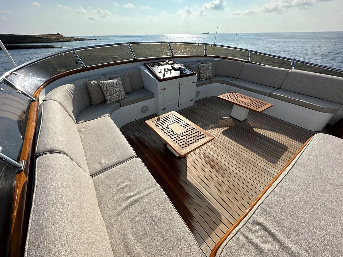 a couch with a piano on it aboard CHEETAH MOON Yacht for Sale