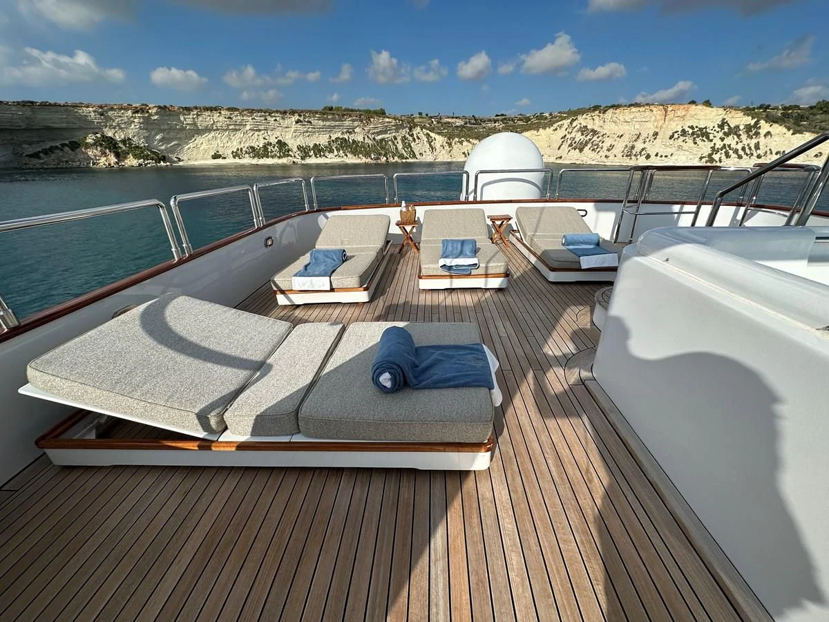 a deck with a laptop on it aboard CHEETAH MOON Yacht for Sale