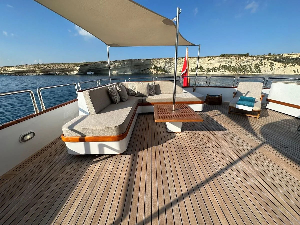 a deck with a flag on it aboard CHEETAH MOON Yacht for Sale