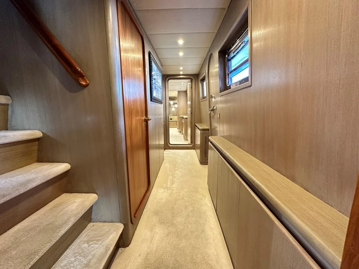a hallway with wooden walls aboard CHEETAH MOON Yacht for Sale