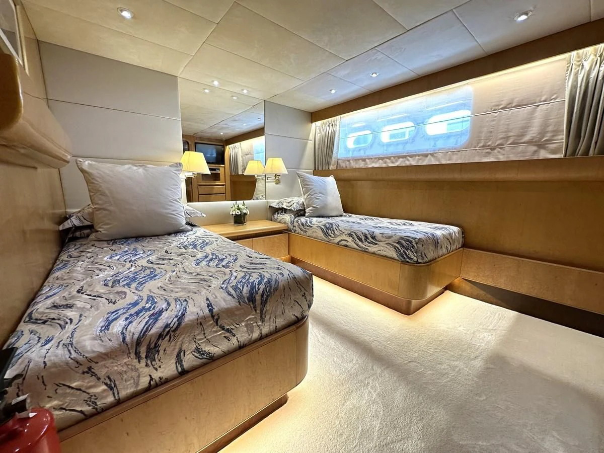 a room with two beds aboard CHEETAH MOON Yacht for Sale