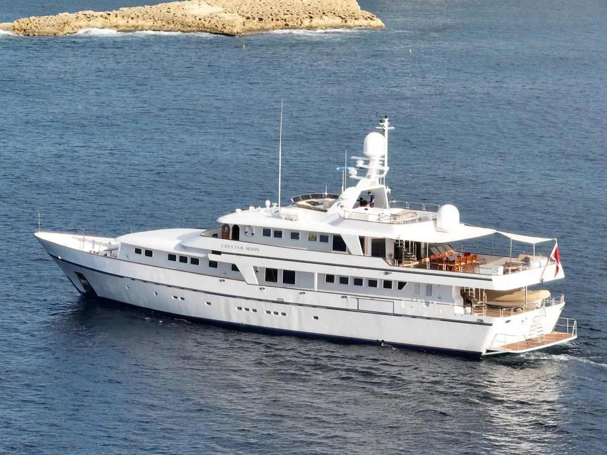 a white boat on the water aboard CHEETAH MOON Yacht for Sale