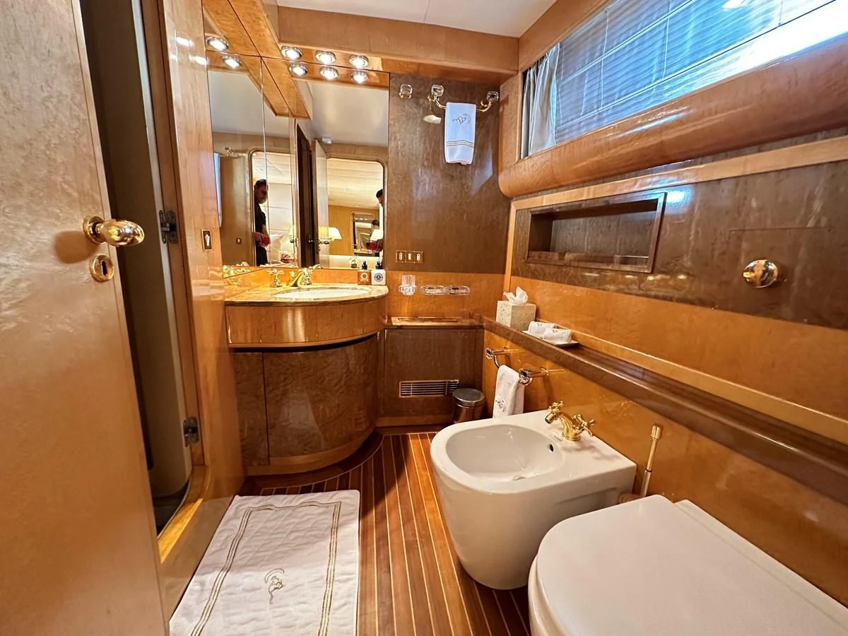 a bathroom with a sink and a bathtub aboard CHEETAH MOON Yacht for Sale