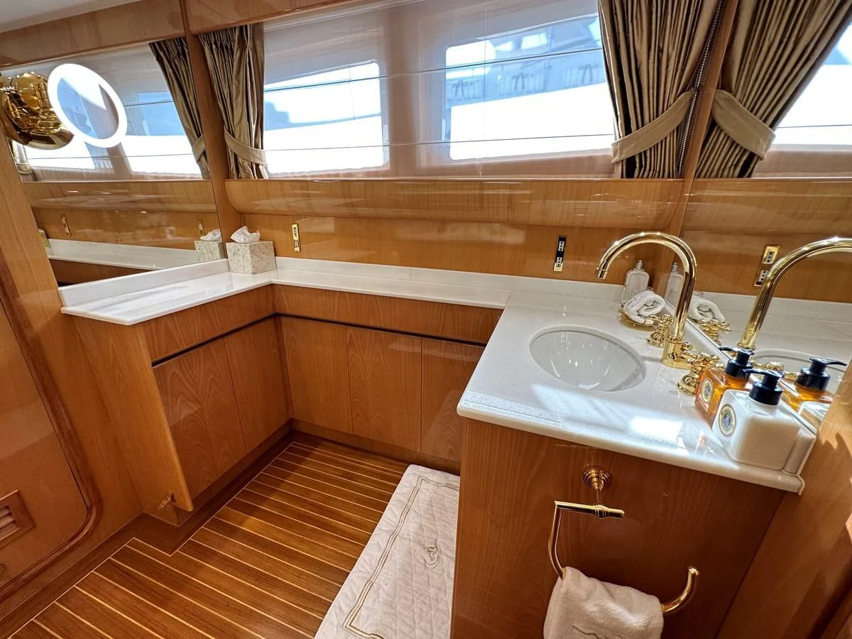 a bathroom with a sink and a mirror aboard CHEETAH MOON Yacht for Sale