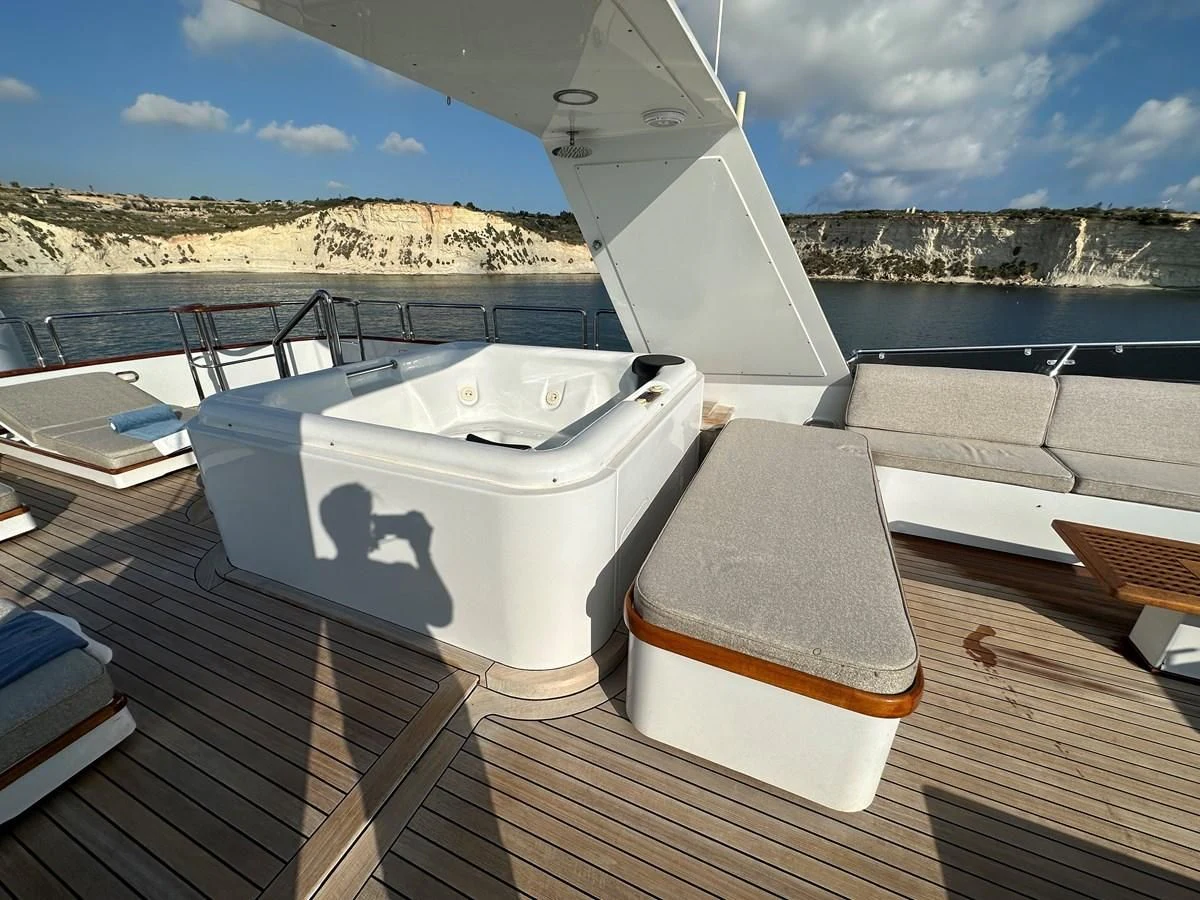 a boat on a deck aboard CHEETAH MOON Yacht for Sale