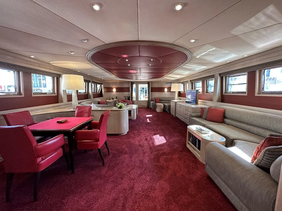 a room with red carpet and a pink carpet aboard CHEETAH MOON Yacht for Sale