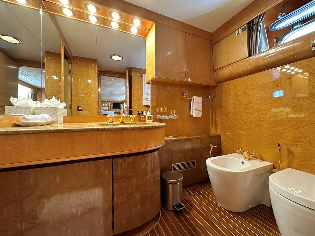 a bathroom with a large mirror aboard CHEETAH MOON Yacht for Sale