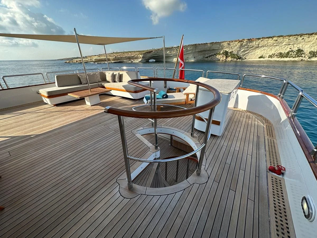 a deck with a chair on it aboard CHEETAH MOON Yacht for Sale