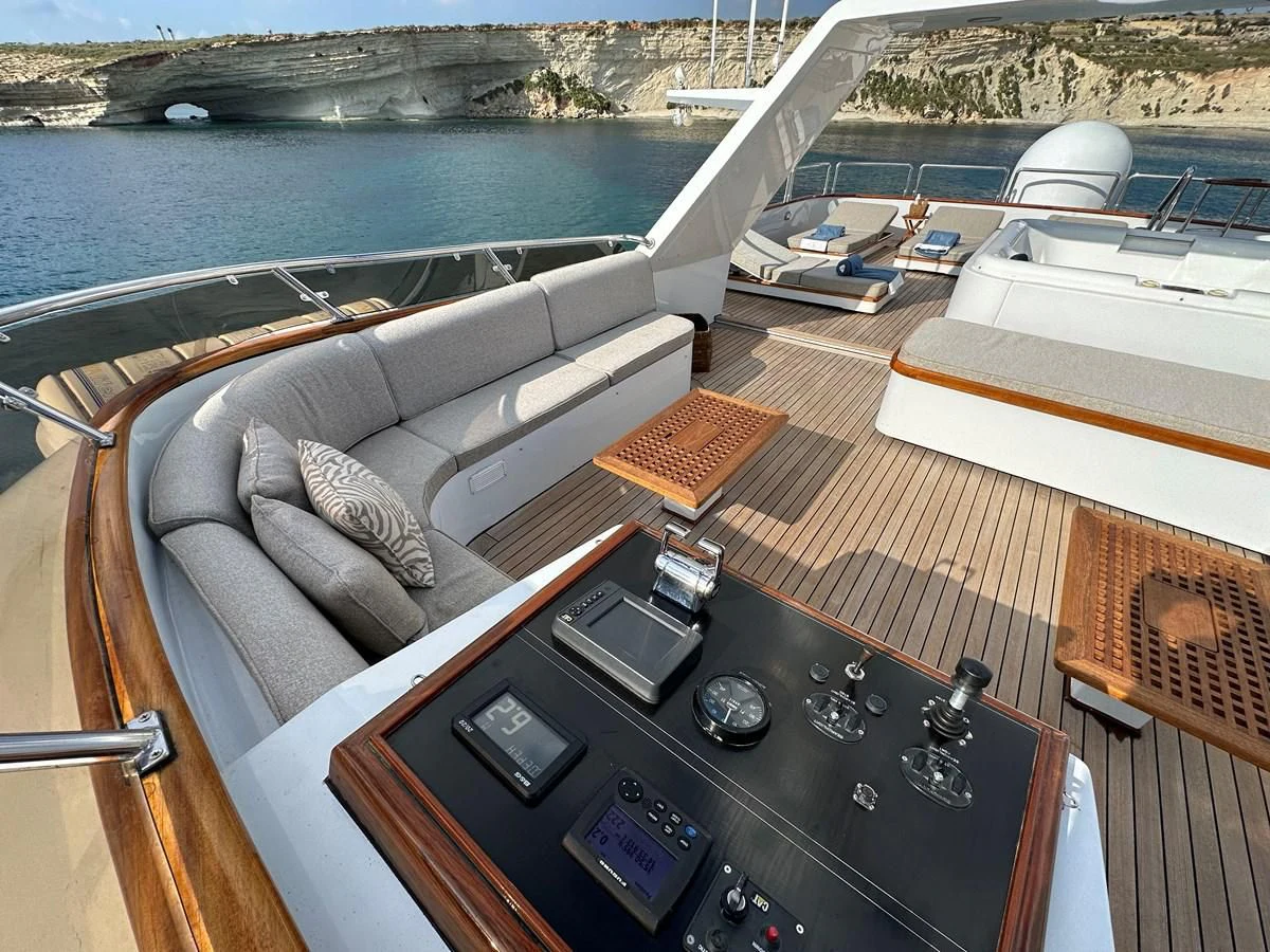 a couch on a deck aboard CHEETAH MOON Yacht for Sale