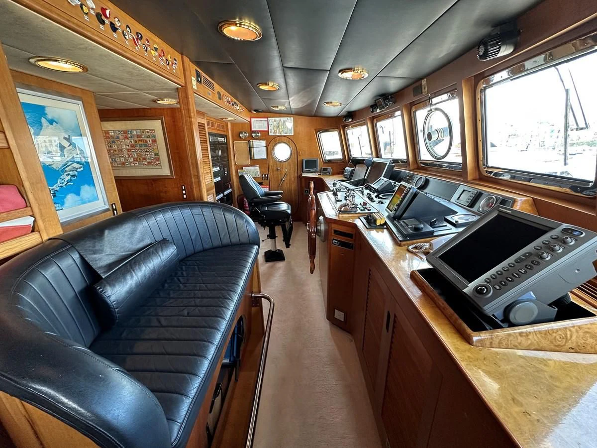 a room with a piano and a piano aboard CHEETAH MOON Yacht for Sale