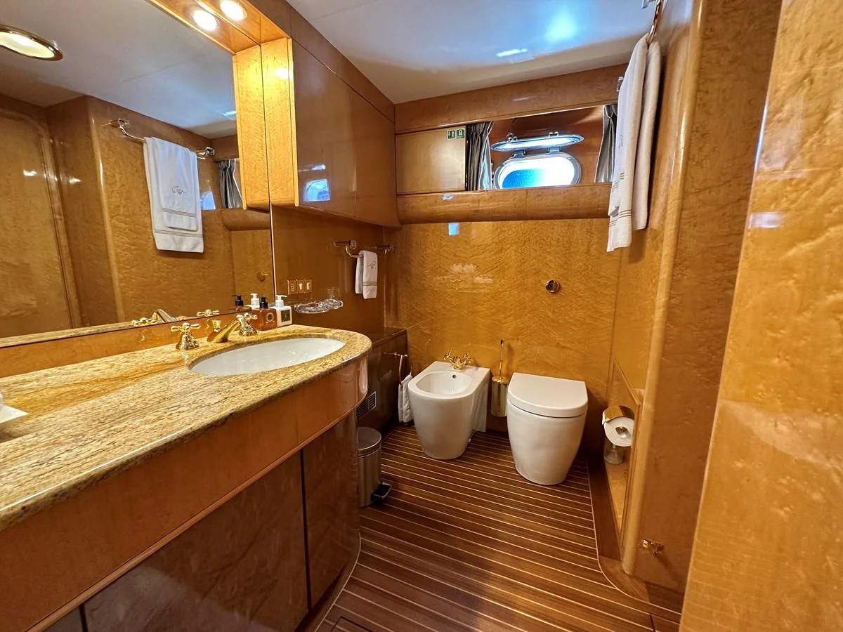 a bathroom with a sink and a toilet aboard CHEETAH MOON Yacht for Sale