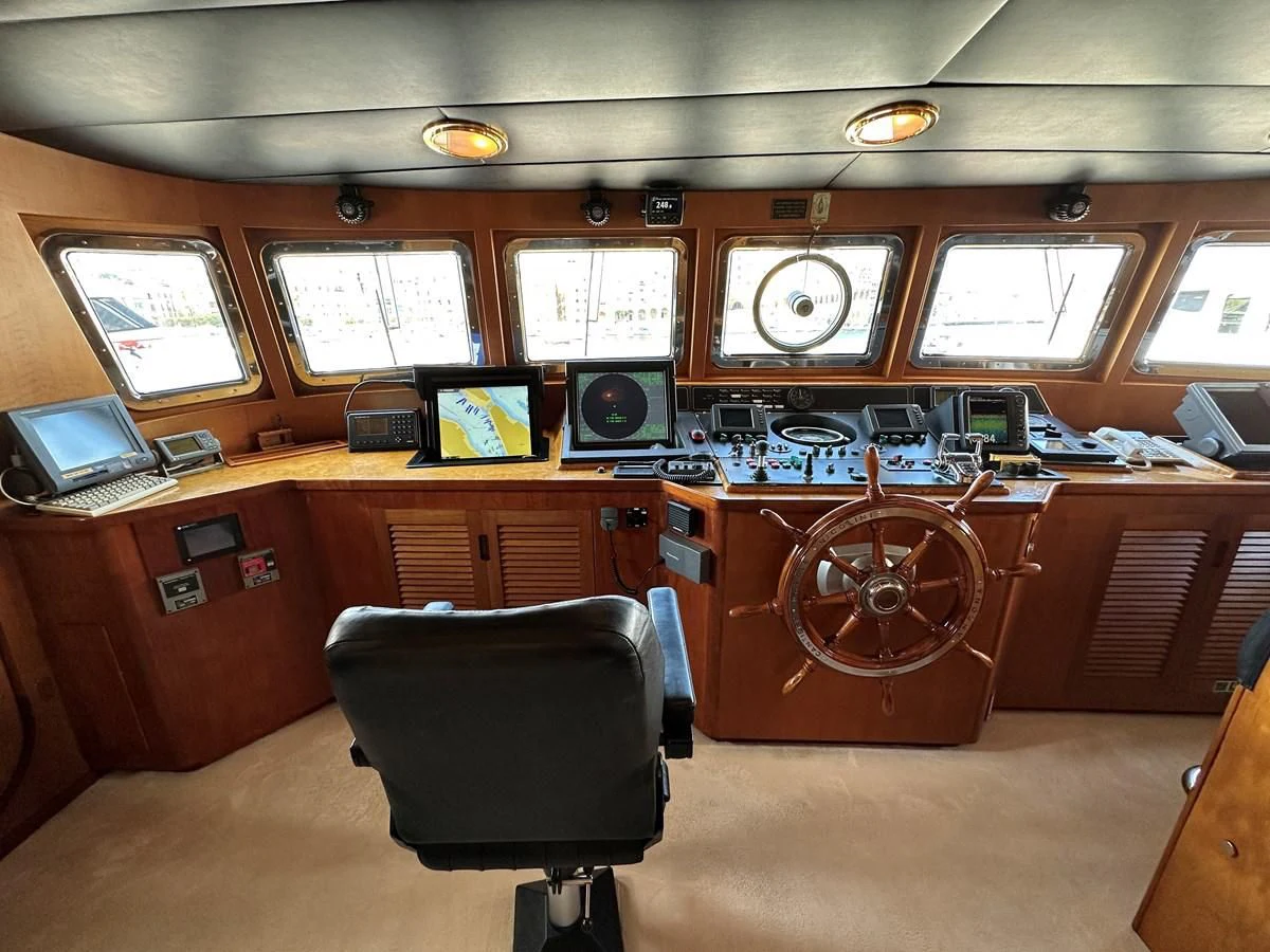 a control room with a chair and a computer aboard CHEETAH MOON Yacht for Sale