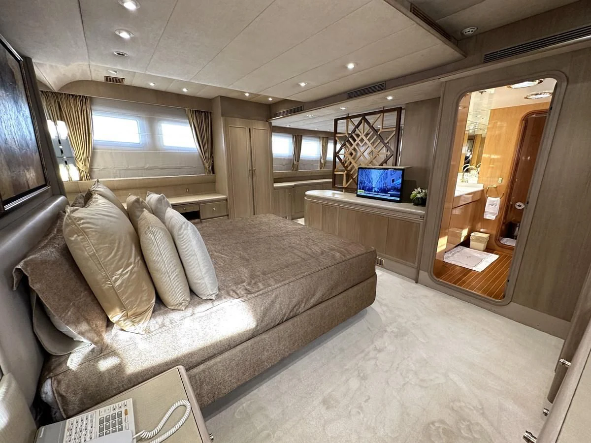 a living room with a couch and a tv aboard CHEETAH MOON Yacht for Sale