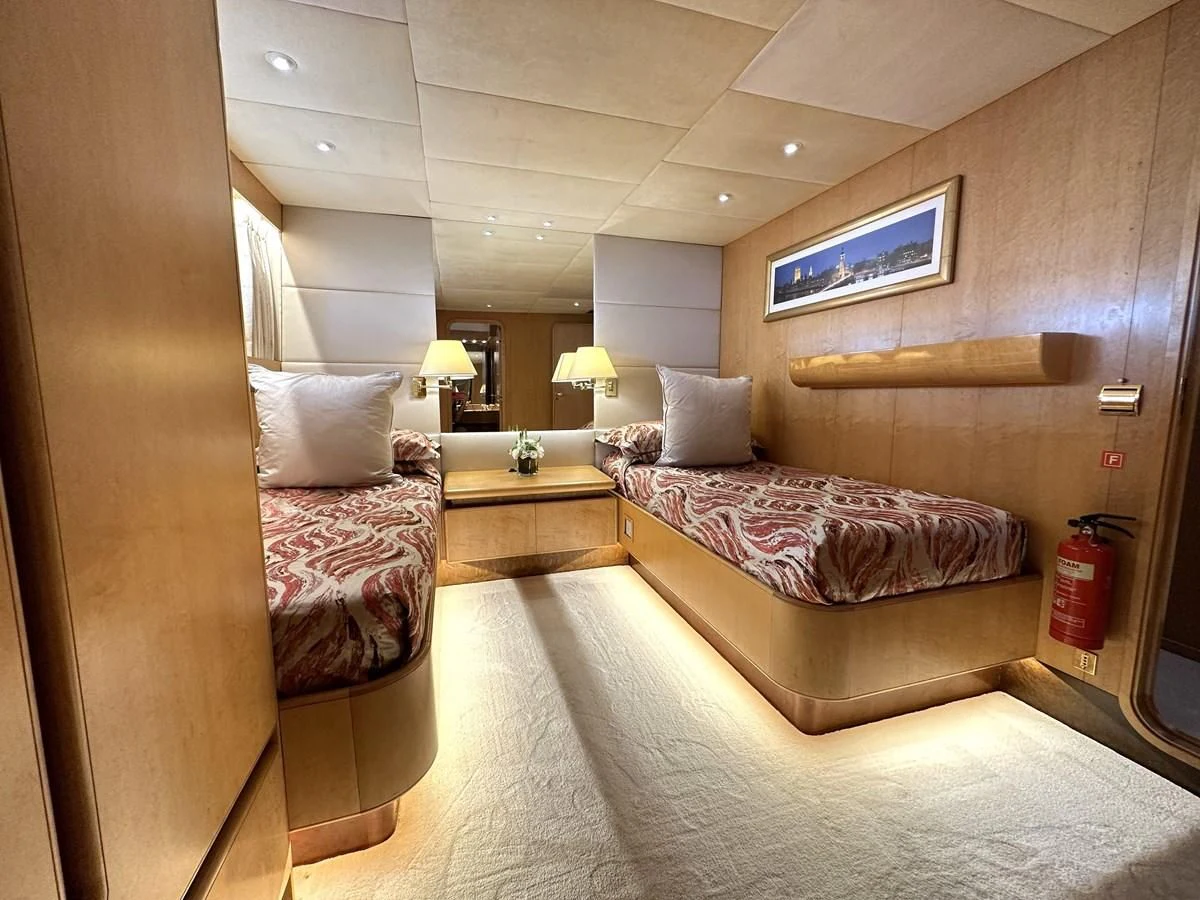 a hotel room with two beds aboard CHEETAH MOON Yacht for Sale