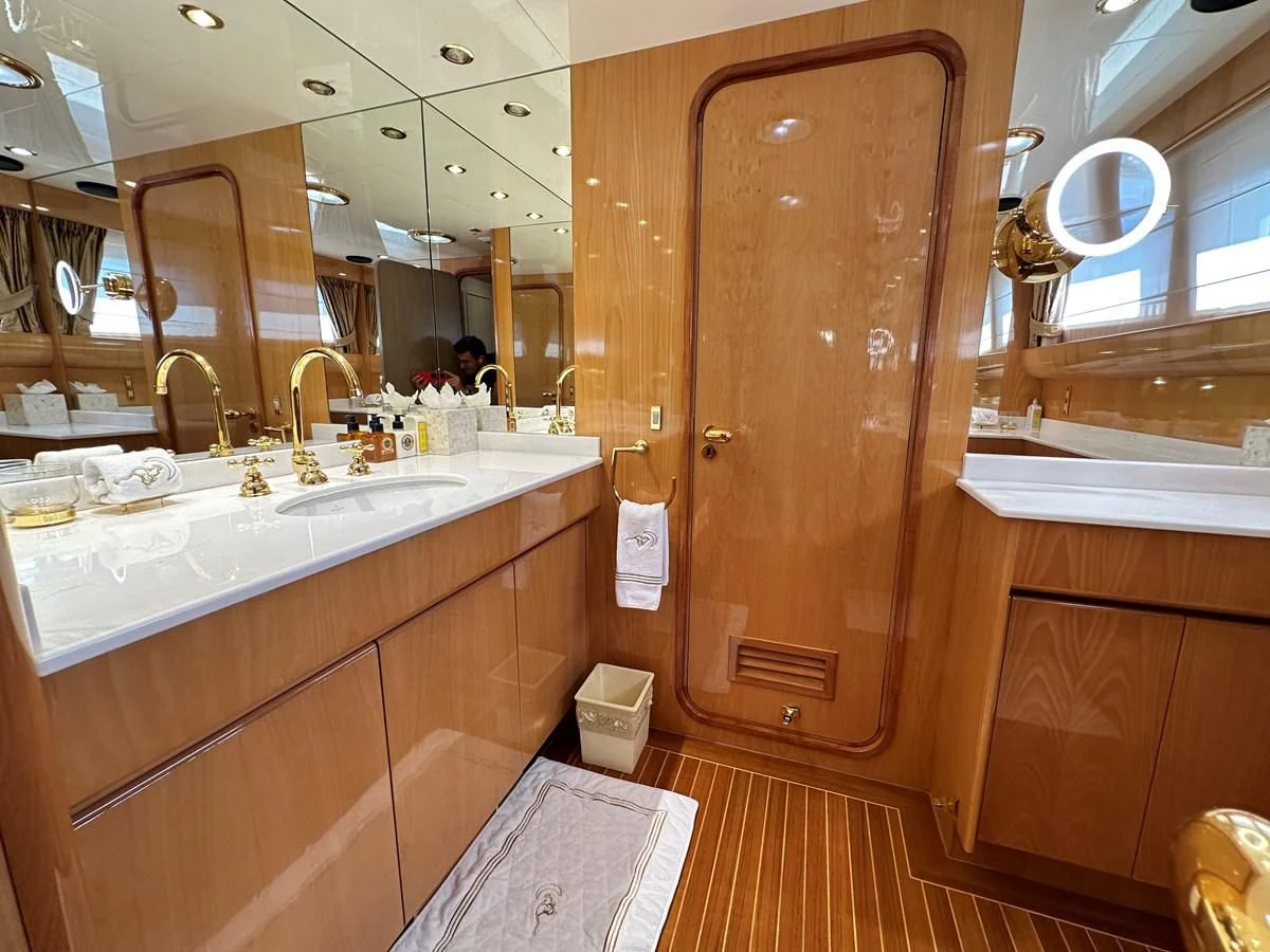 a bathroom with a sink and a mirror aboard CHEETAH MOON Yacht for Sale