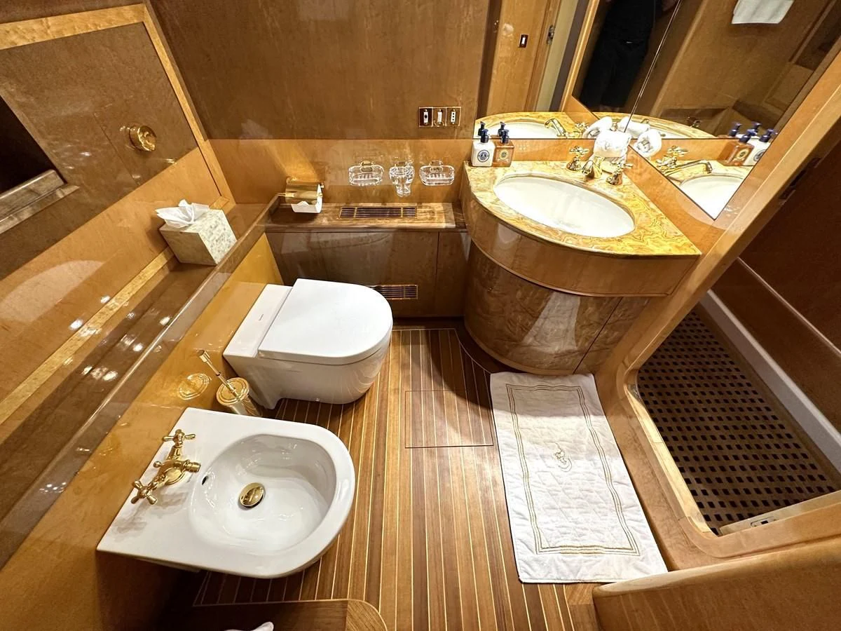 a bathroom with a sink and a toilet aboard CHEETAH MOON Yacht for Sale