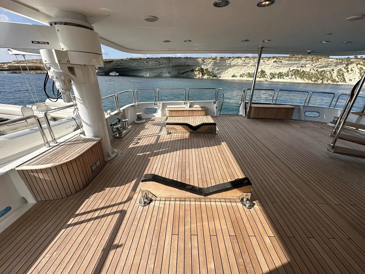 a deck with a bench and a pool aboard CHEETAH MOON Yacht for Sale