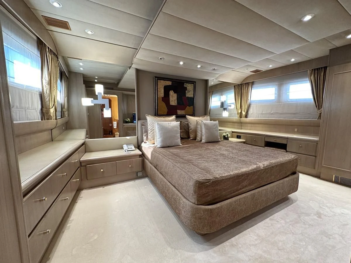 a large bedroom with a bed aboard CHEETAH MOON Yacht for Sale