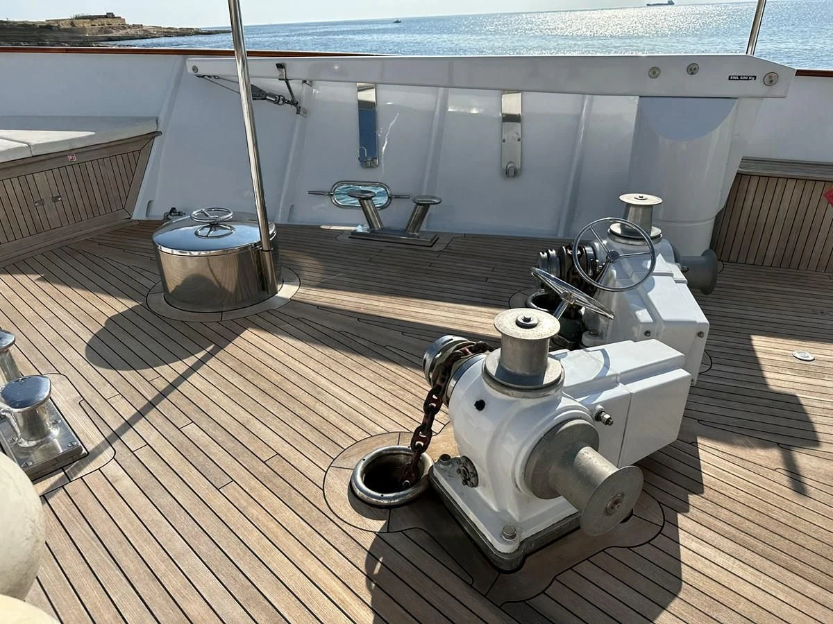 a white machine on a wooden platform aboard CHEETAH MOON Yacht for Sale