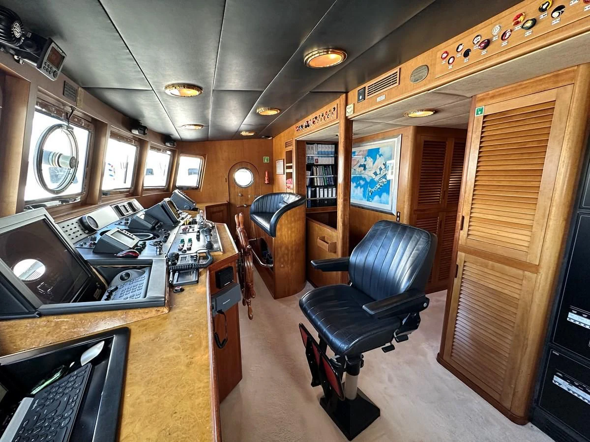 a room with a desk and chairs aboard CHEETAH MOON Yacht for Sale