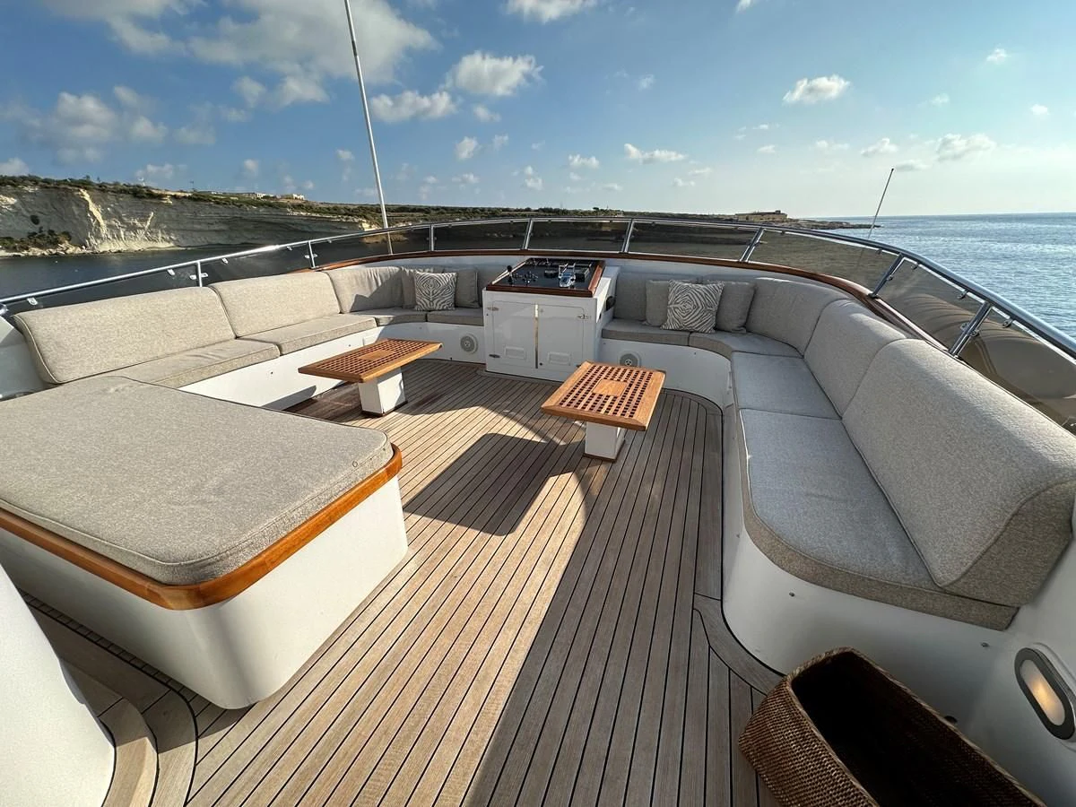 a deck with a view of the ocean and a deck aboard CHEETAH MOON Yacht for Sale