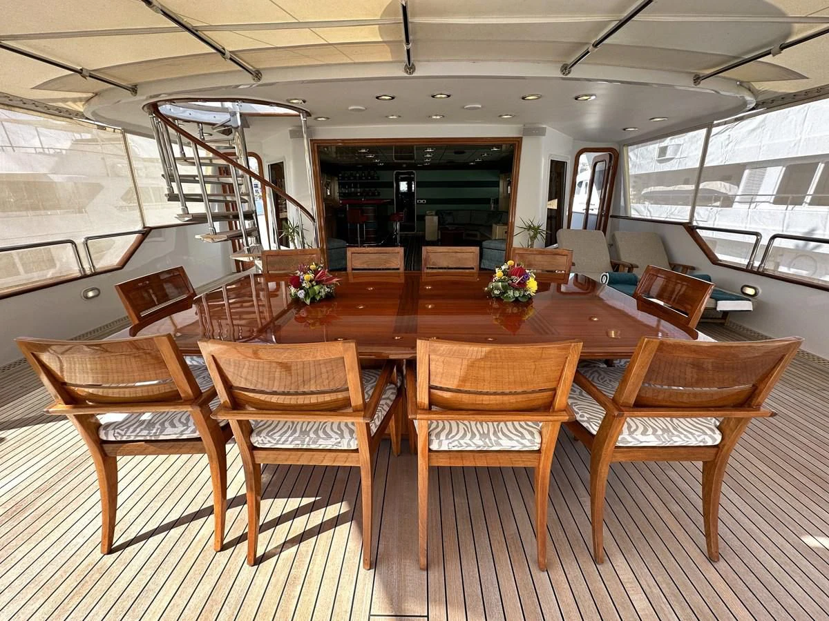 a large room with wooden tables aboard CHEETAH MOON Yacht for Sale