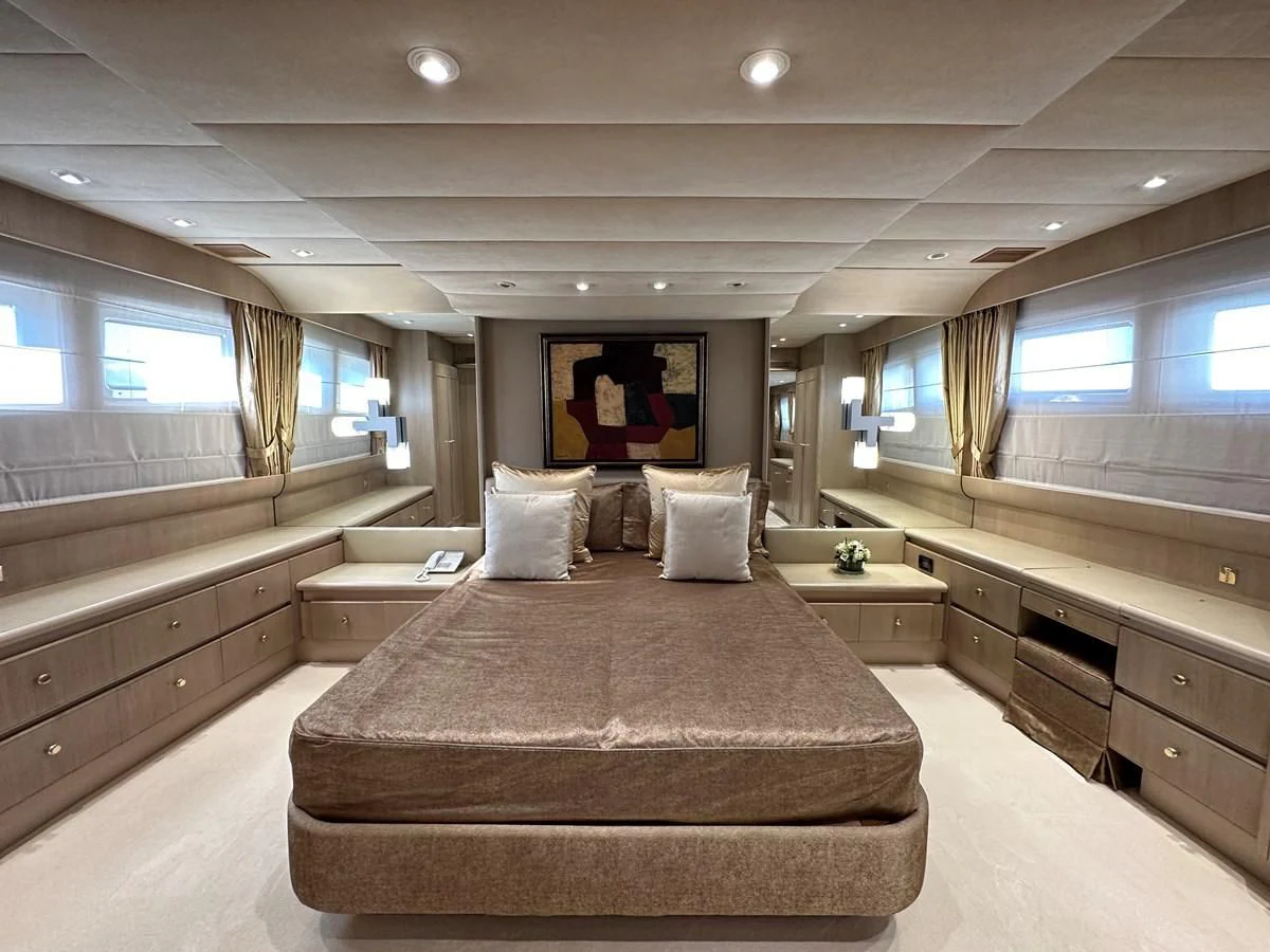 a large bedroom with a large bed aboard CHEETAH MOON Yacht for Sale