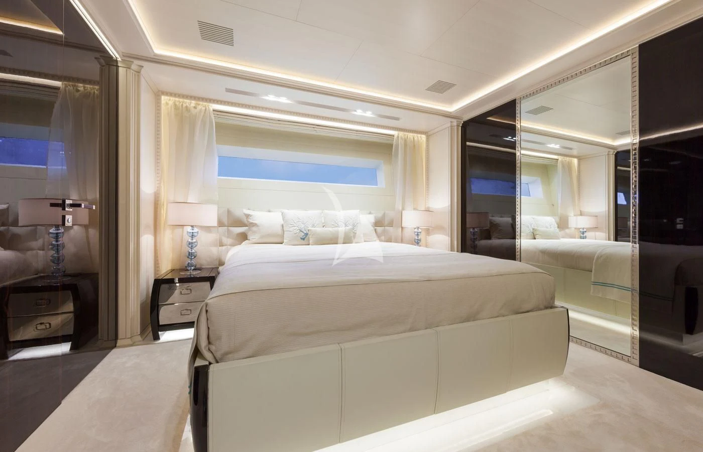 a room with a bed and a window aboard PARILLION Yacht for Sale