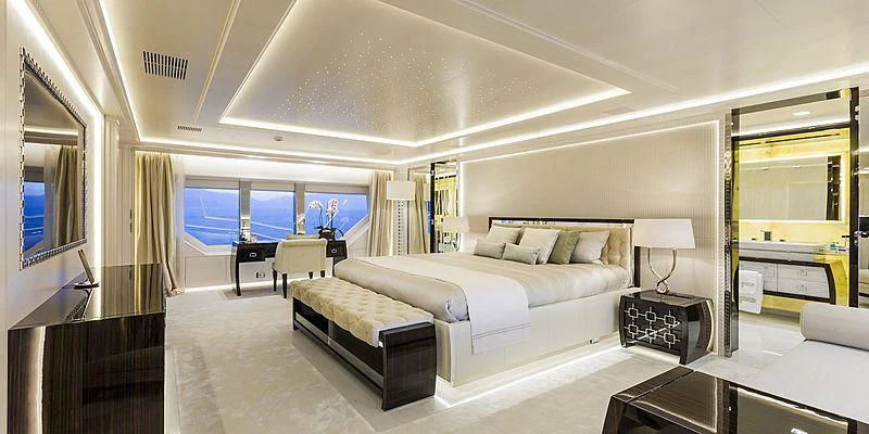 a large bedroom with a large bed aboard PARILLION Yacht for Sale