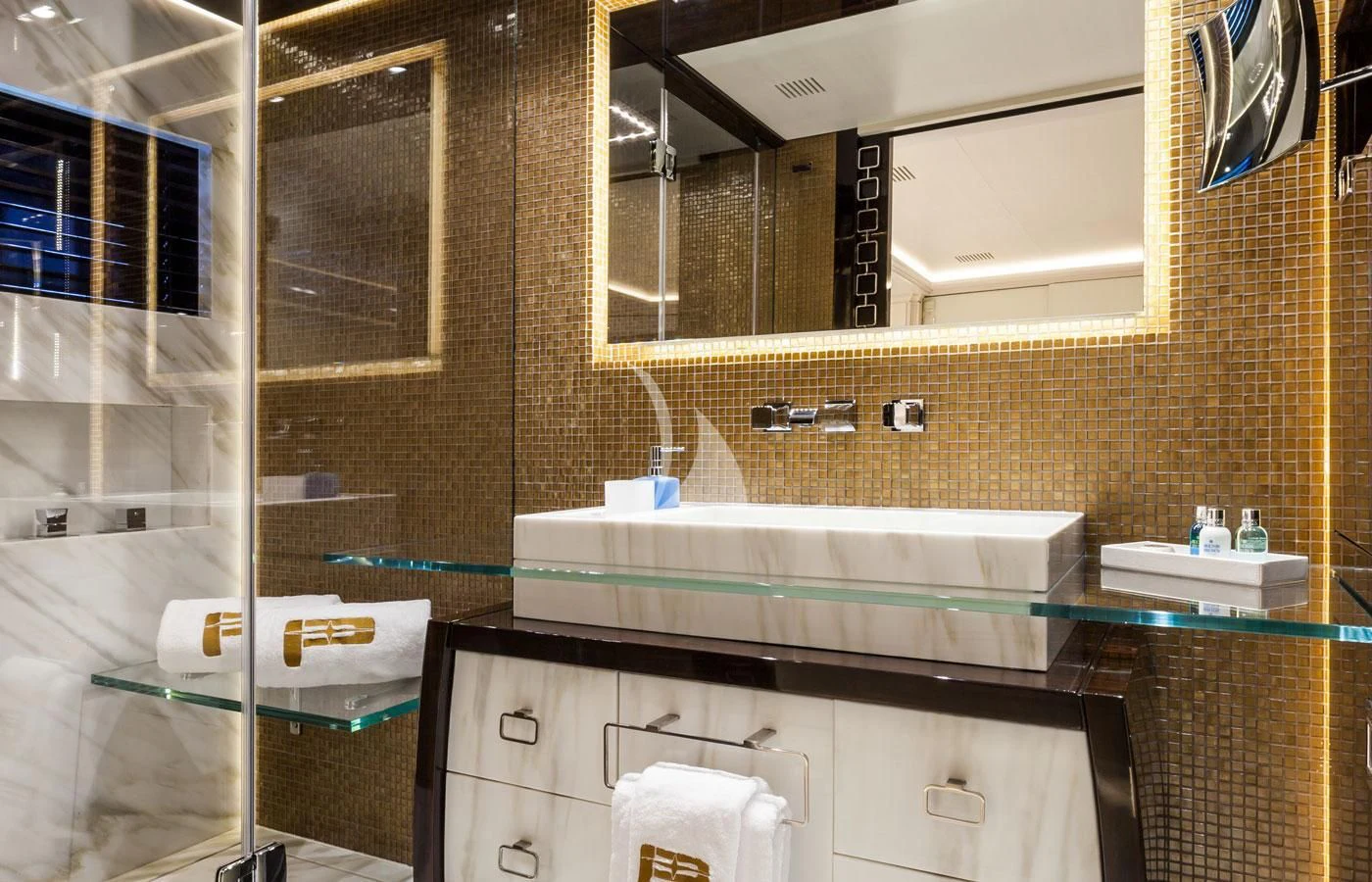 a bathroom with a glass shower aboard PARILLION Yacht for Sale