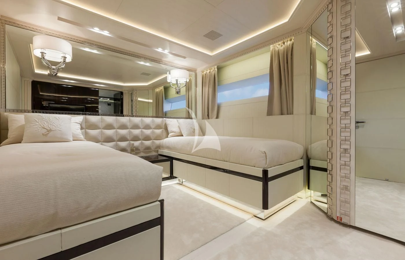 a room with a bed and a couch aboard PARILLION Yacht for Sale