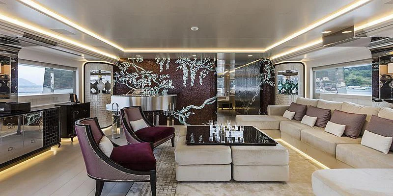 a living room with a large screen aboard PARILLION Yacht for Sale