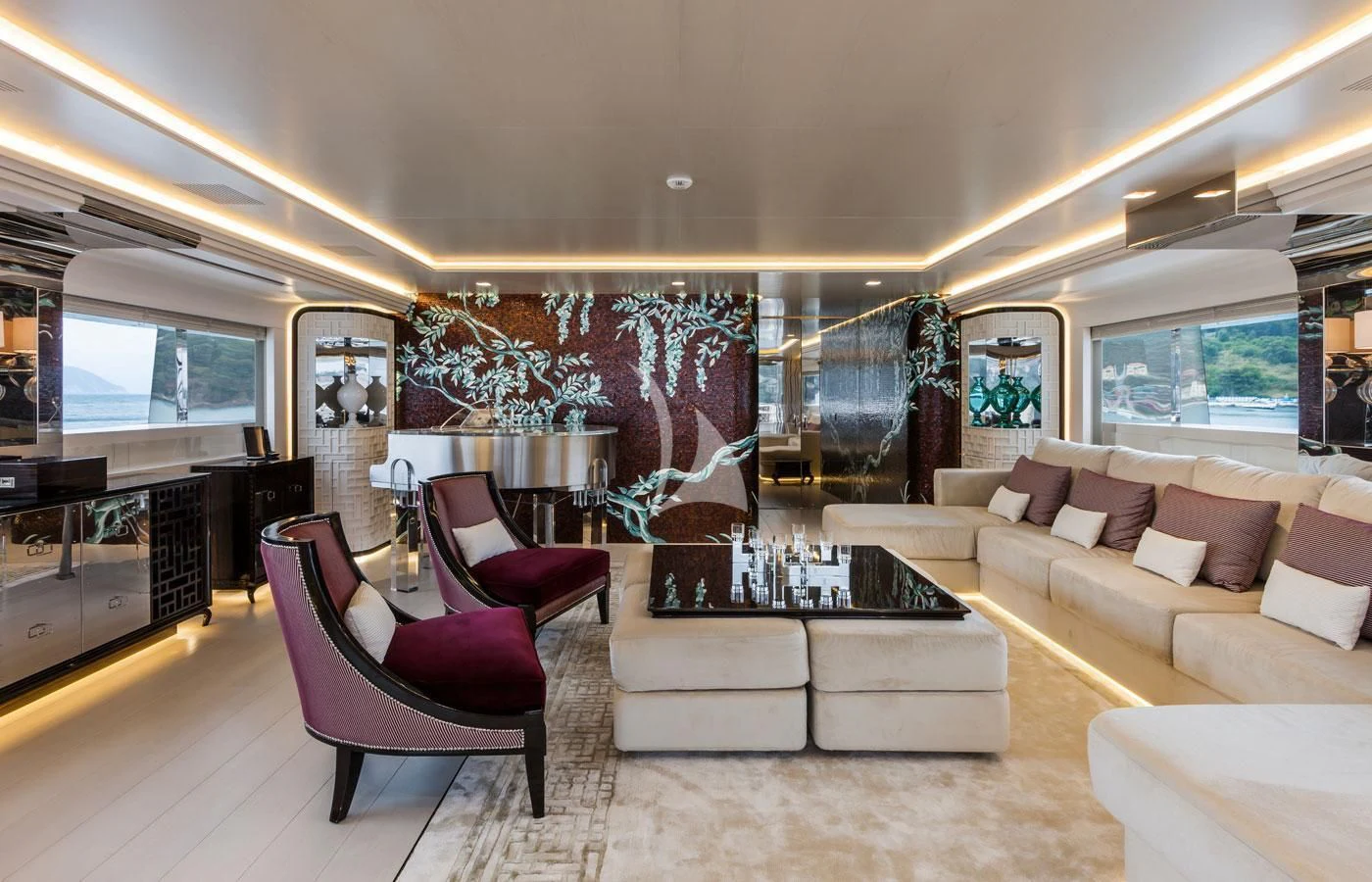 a living room with a large screen aboard PARILLION Yacht for Sale