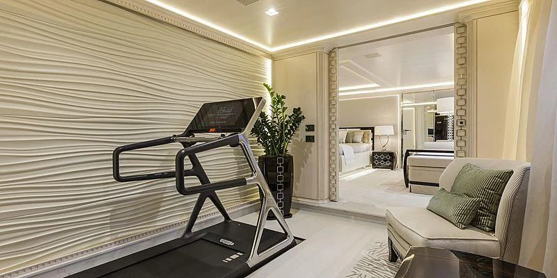 a room with a bed and a desk aboard PARILLION Yacht for Sale