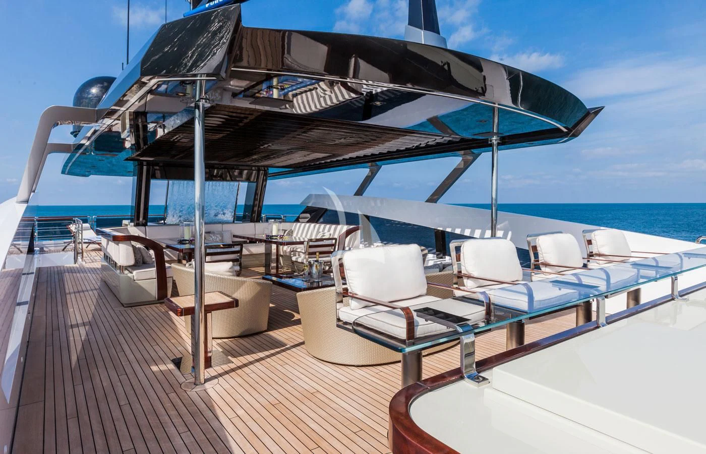 a deck with a large umbrella aboard PARILLION Yacht for Sale