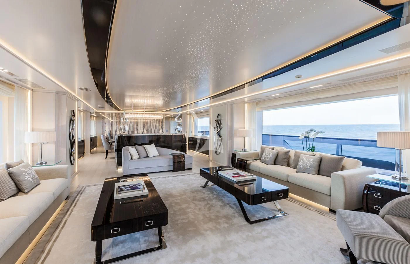 a living room with a large window aboard PARILLION Yacht for Sale