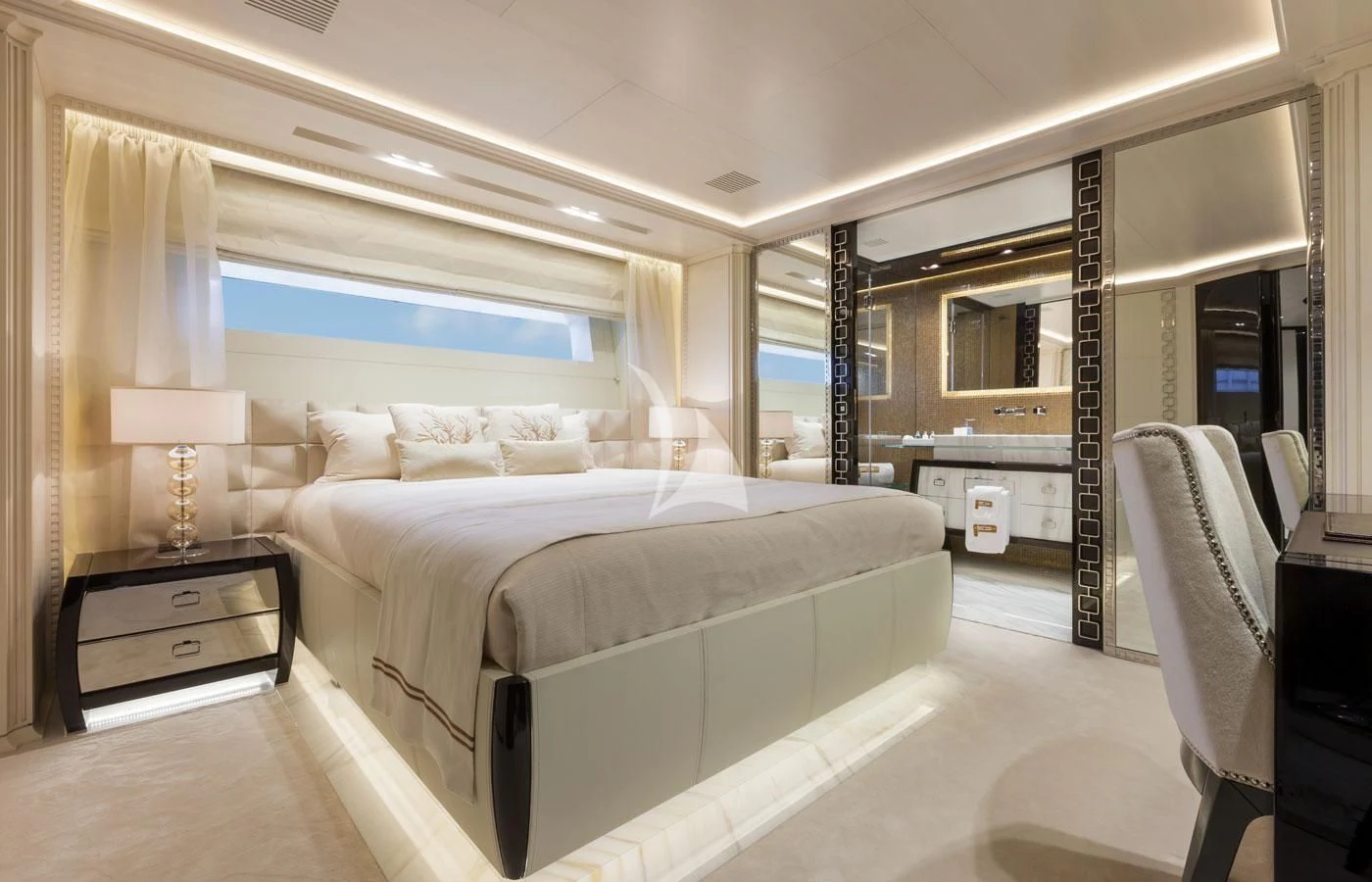 a room with a bed and a desk aboard PARILLION Yacht for Sale