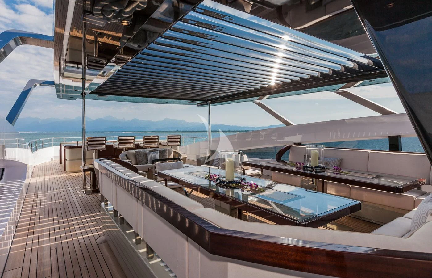 a large room with a deck and a pool aboard PARILLION Yacht for Sale