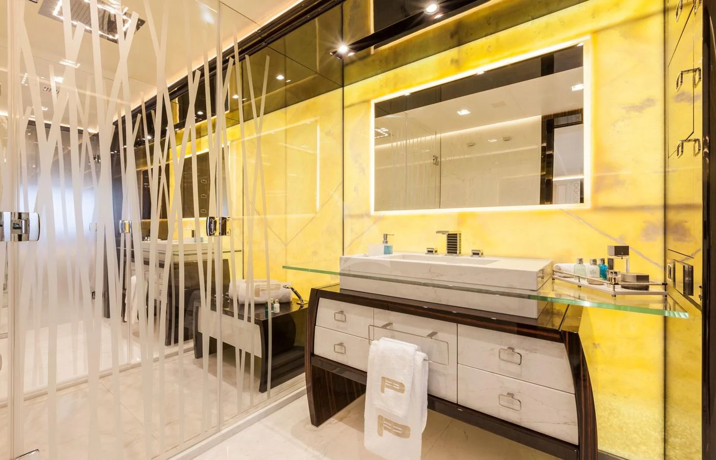 a large bathroom with a large mirror aboard PARILLION Yacht for Sale