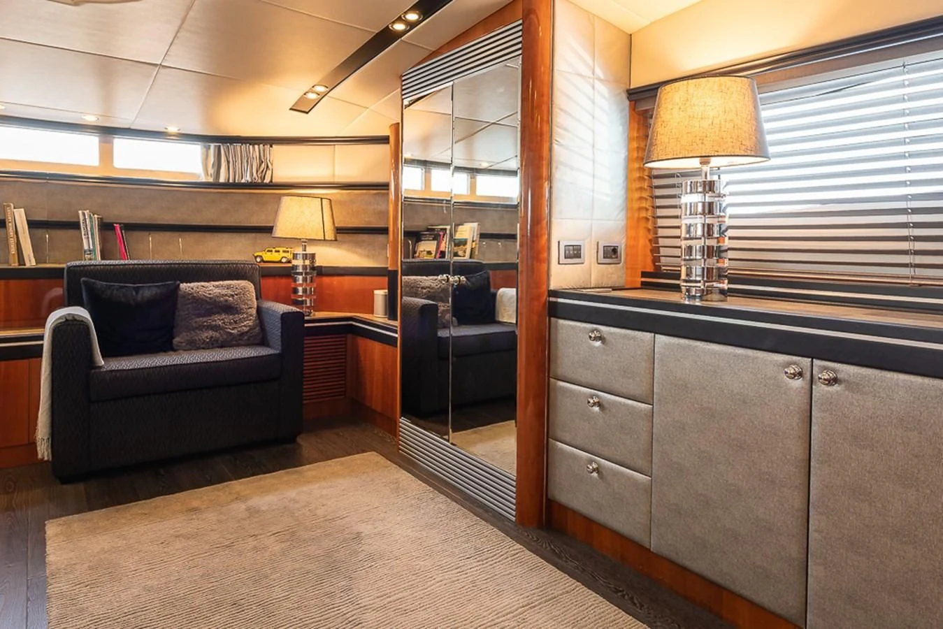 a living room with a couch and a coffee table aboard SMOOTH OPERATOR Yacht for Sale
