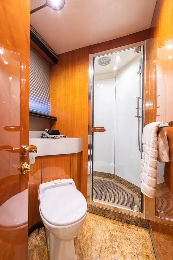 a bathroom with a glass shower door aboard SMOOTH OPERATOR Yacht for Sale