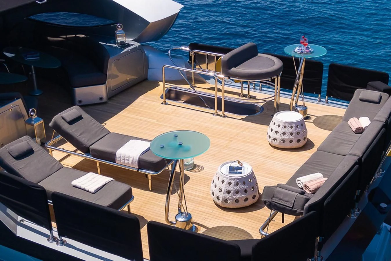 a room with a couch and a table with chairs on it aboard SMOOTH OPERATOR Yacht for Sale
