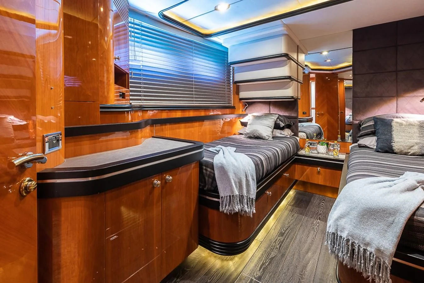 a room with a bed and a dresser aboard SMOOTH OPERATOR Yacht for Sale