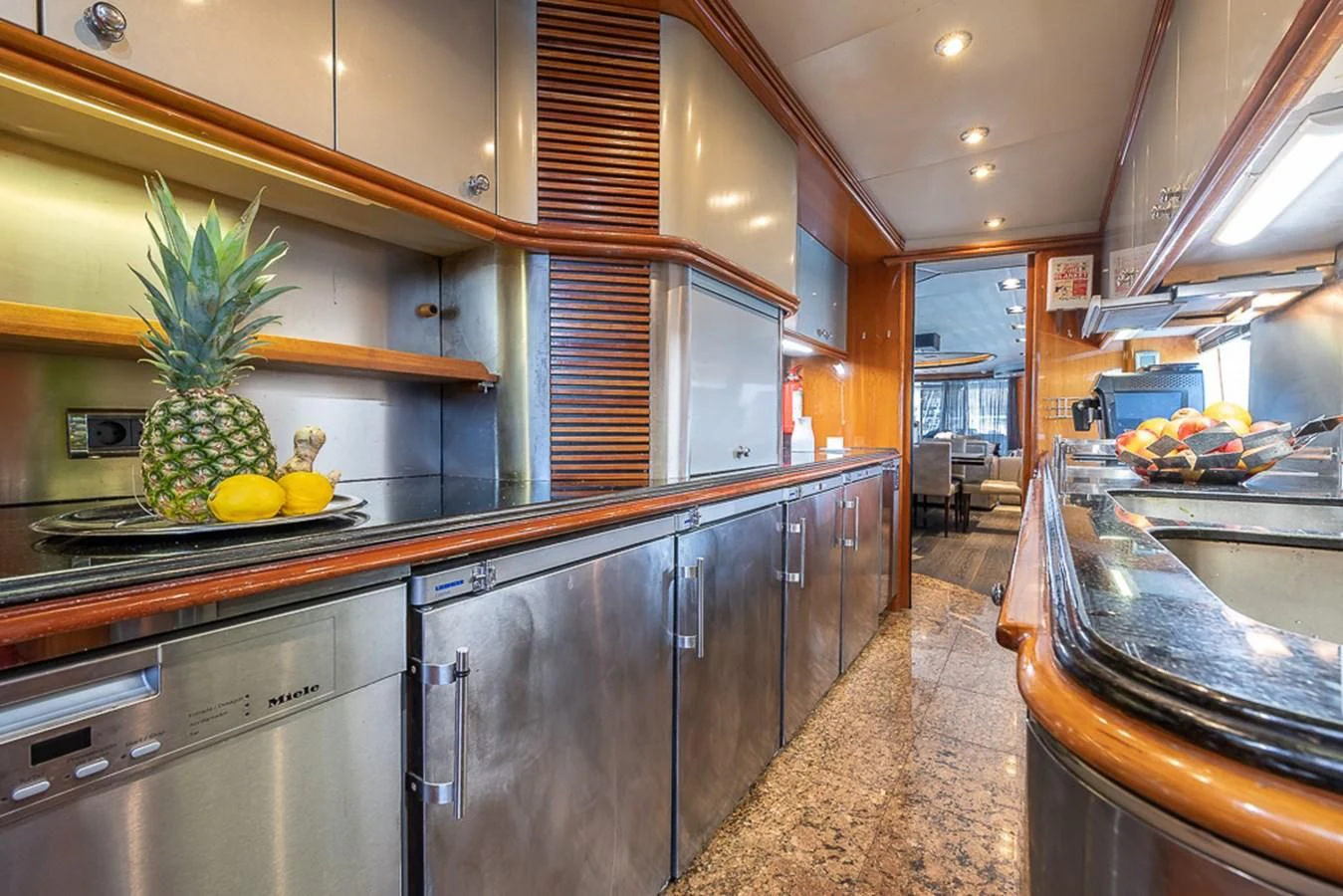 a kitchen with a large island aboard SMOOTH OPERATOR Yacht for Sale