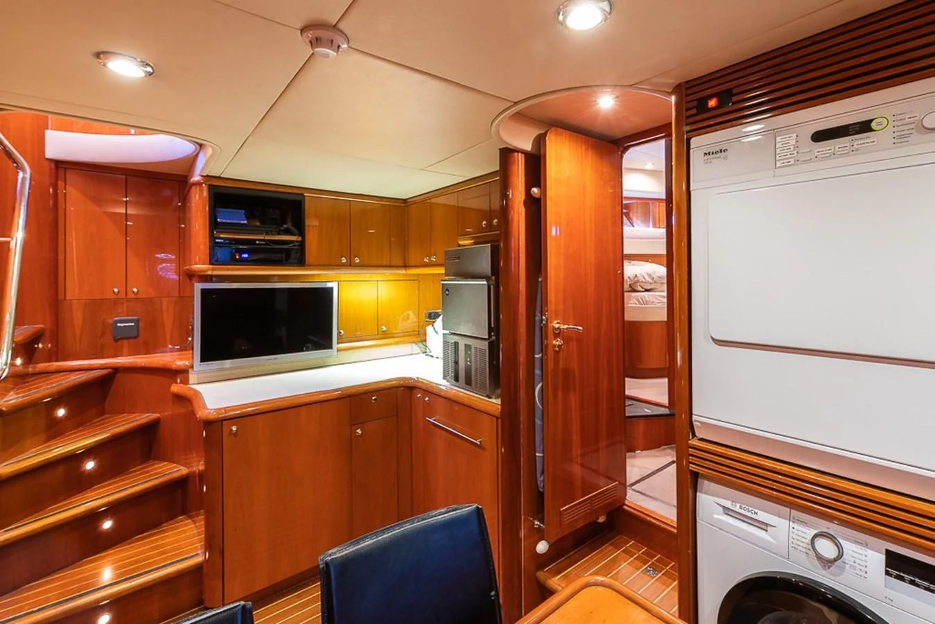 a kitchen with wooden cabinets aboard SMOOTH OPERATOR Yacht for Sale