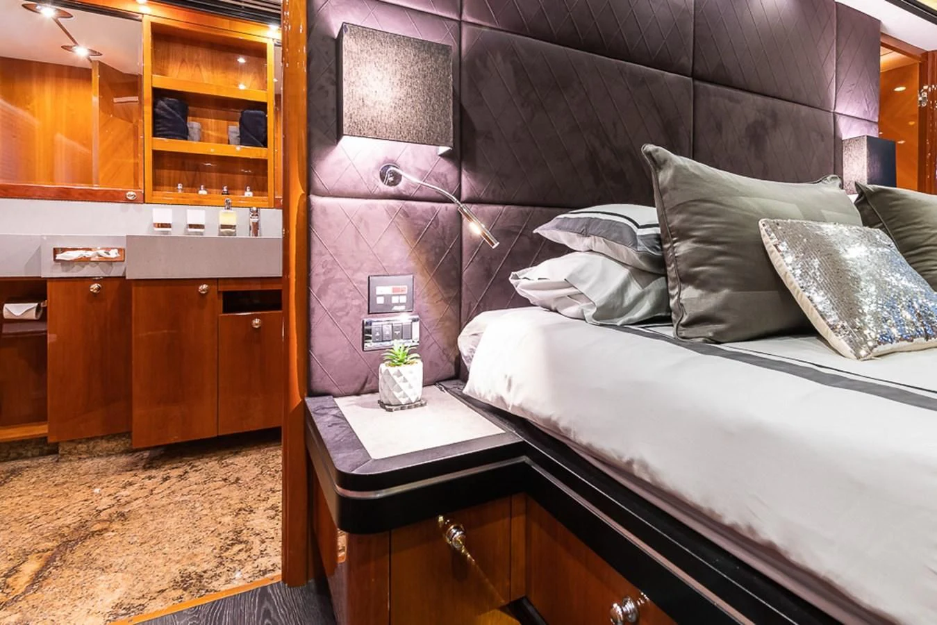 a bed with a wooden headboard aboard SMOOTH OPERATOR Yacht for Sale