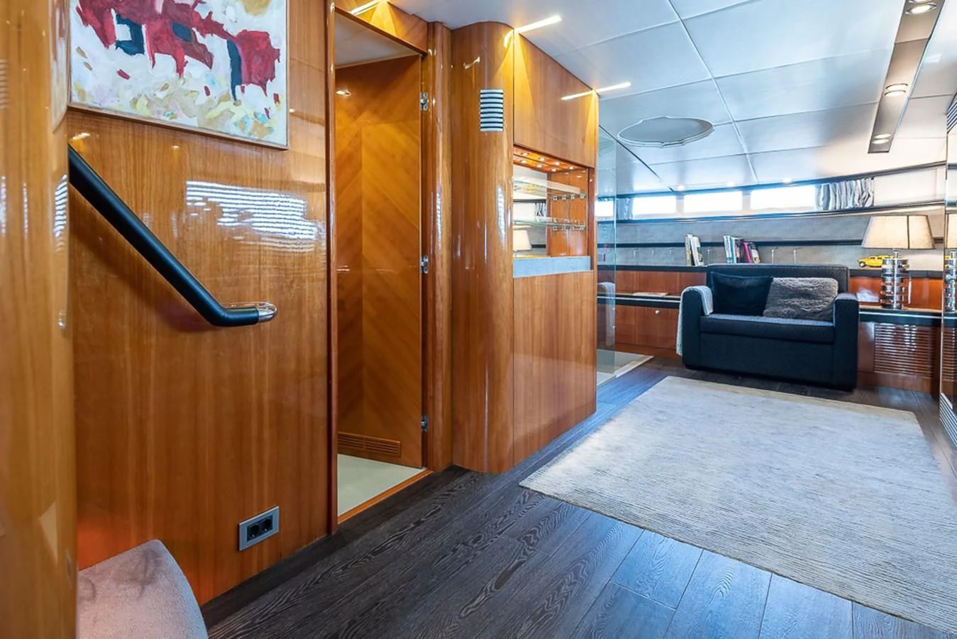 a room with a wood door and a couch aboard SMOOTH OPERATOR Yacht for Sale