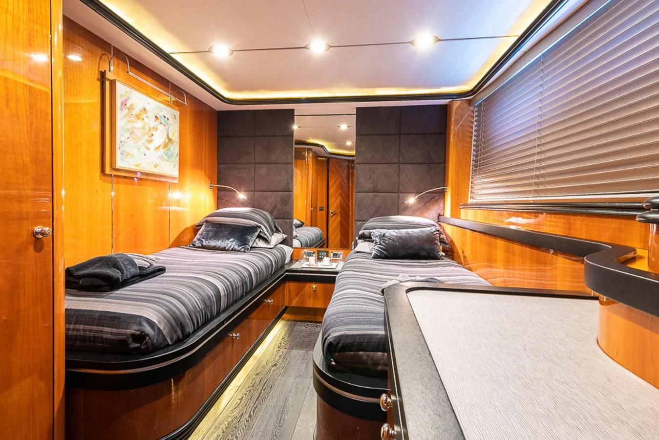 a room with a bed and a couch aboard SMOOTH OPERATOR Yacht for Sale