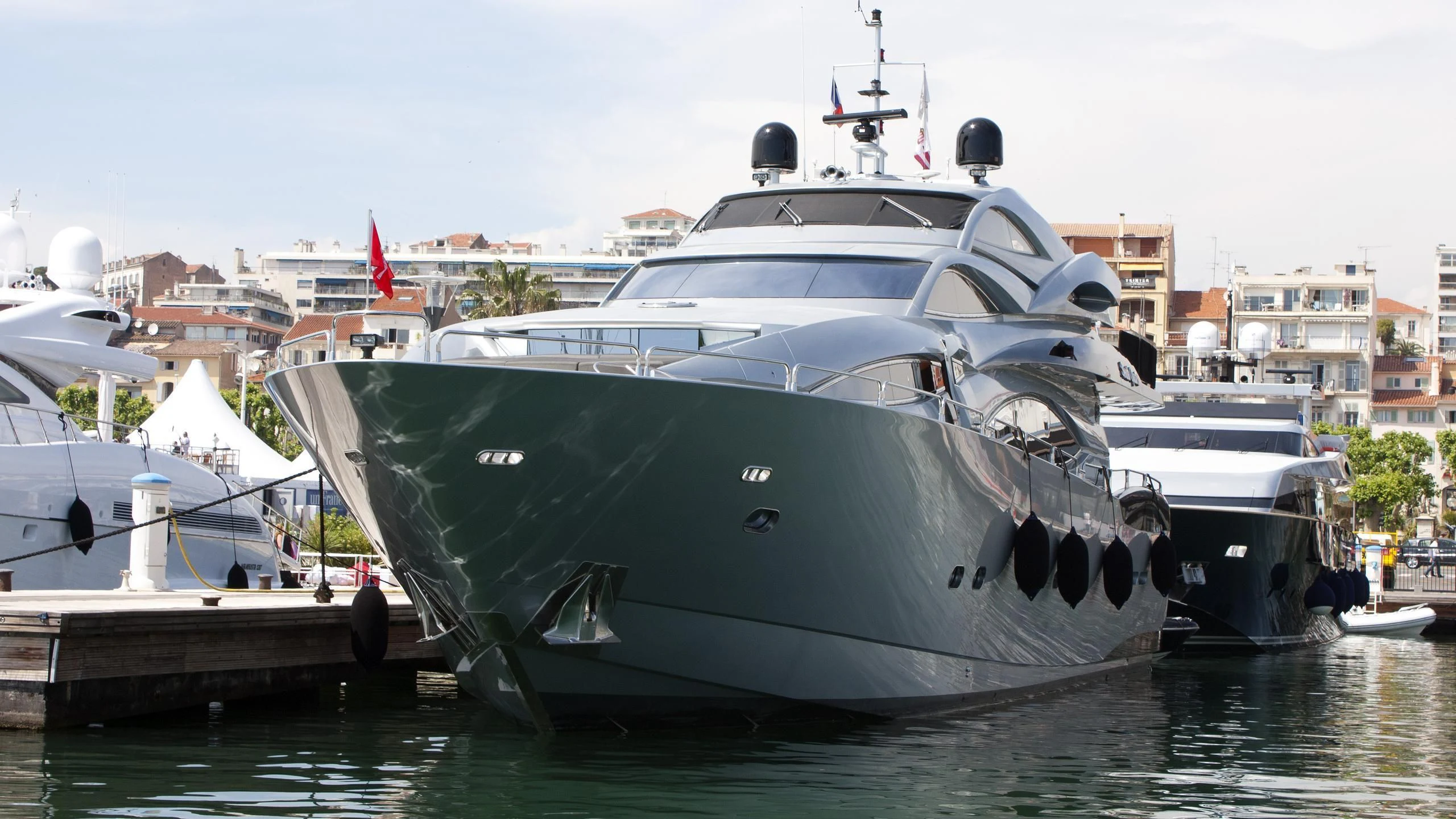 a large boat docked at a pier aboard SMOOTH OPERATOR Yacht for Sale